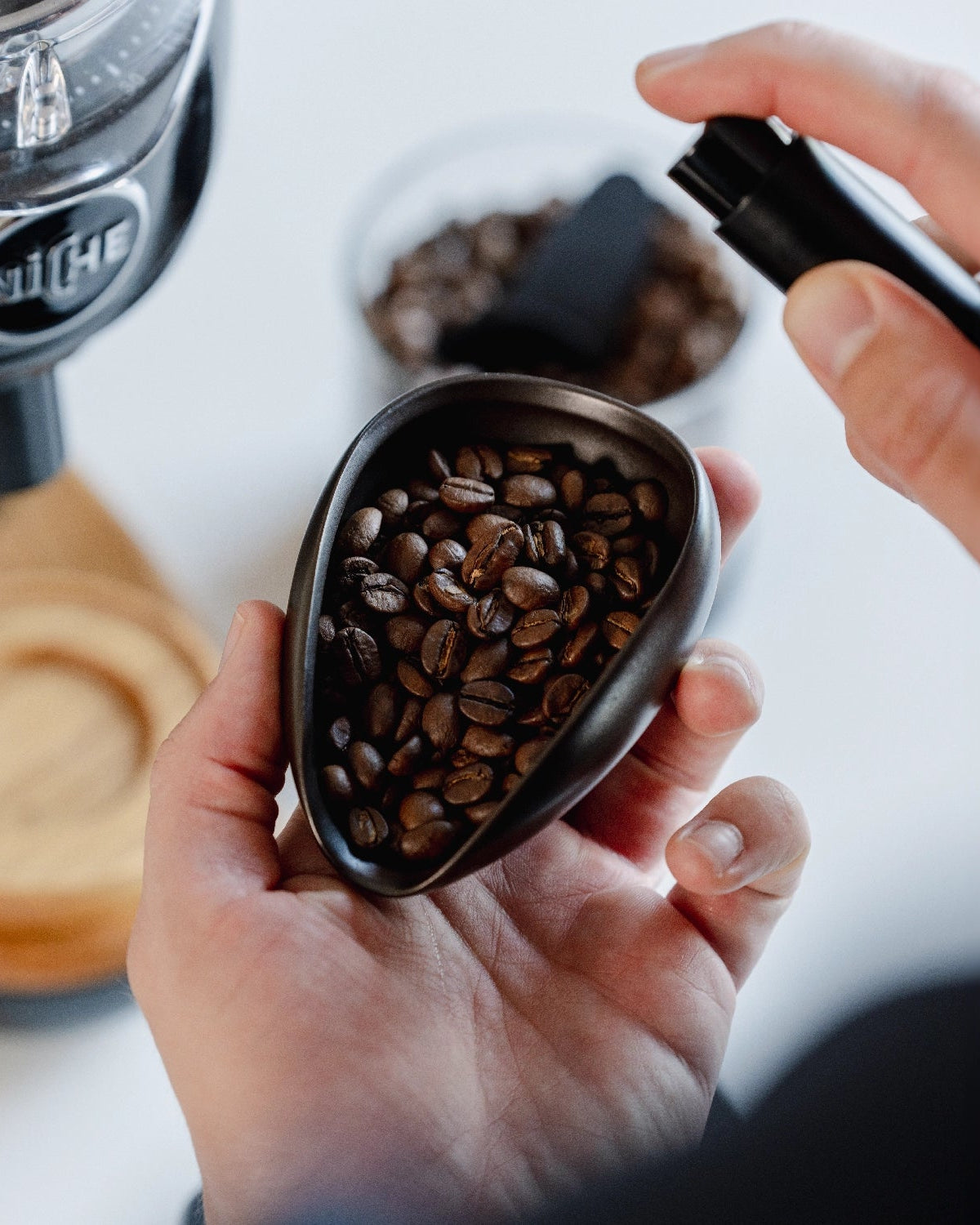 Coffee Dosing tray from Barista-Essentials while using RDT spray with Niche grinder in background